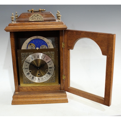 183 - A George III style oak cased 'bracket' clock, 16cm arched dial with moonphase, silvered chapter ring... 