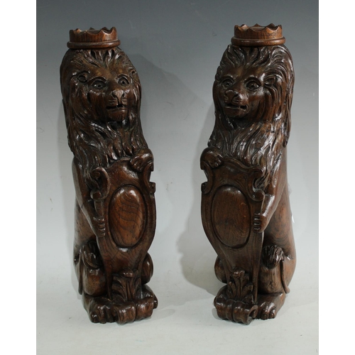 190 - Architectural Salvage - a pair of carved oak newell post/library models, each as a crowned lion. 42c... 