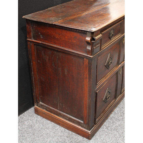 202 - A late 17th century oak block front chest, slightly oversailing rectangular top above a faux-dentil ... 