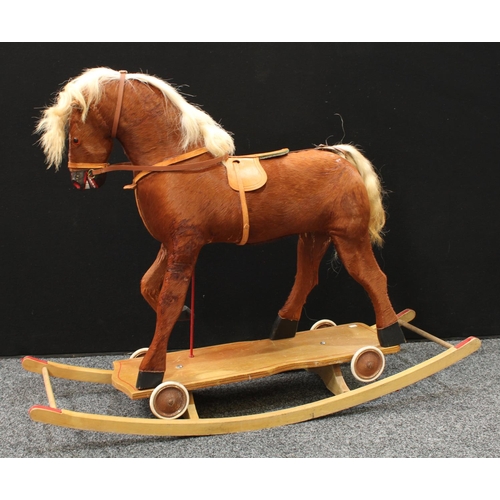 232 - A mid-20th century child's combination rocking and 'pull-along' horse, 70cm high floor to saddle, 12... 