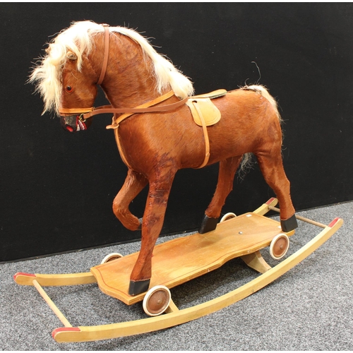 232 - A mid-20th century child's combination rocking and 'pull-along' horse, 70cm high floor to saddle, 12... 