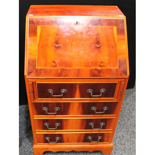 235 - A yew chest of four long drawers, 92cm high, 86cm wide; a similar side cabinet and bureau (3)