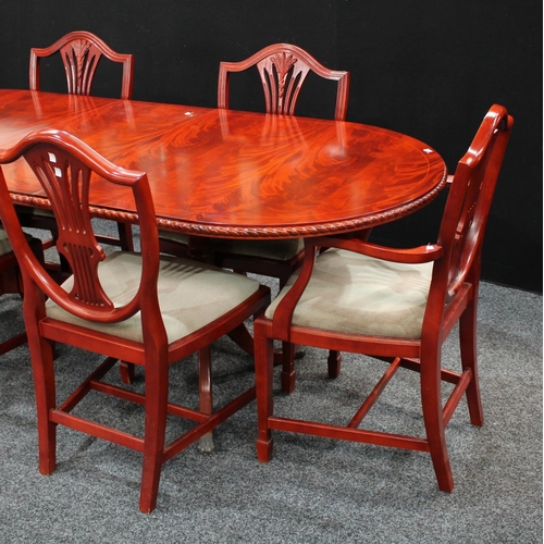 239 - A Regency inspired extending dining table, discorectangular top with one additional leaf, sabre legs... 