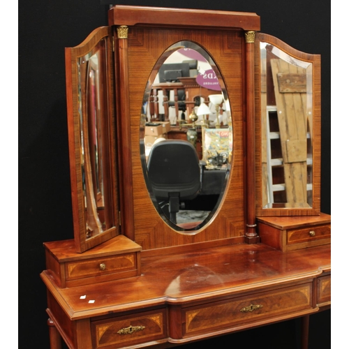 251 - An Empire style dressing table, substantial triptych mirror arrangement above a slightly break-centr... 