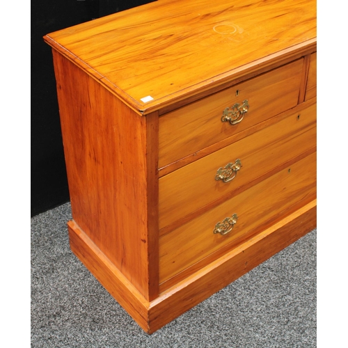 252 - An early 20th century low chest, of two short over two long drawers, plinth base, 75.5cm high, 106.5... 