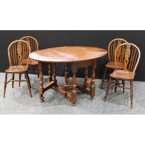 259 - A 17th century style gateleg dining table; a set of four wheel back dining side chairs (5)