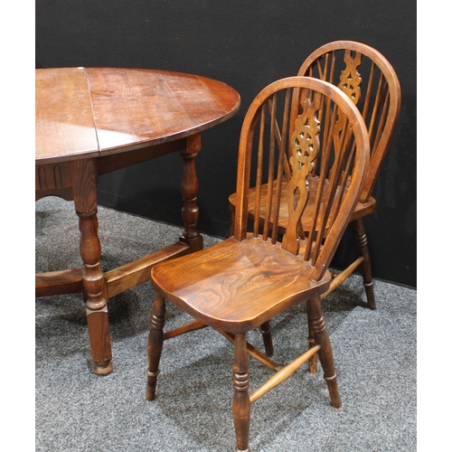 259 - A 17th century style gateleg dining table; a set of four wheel back dining side chairs (5)