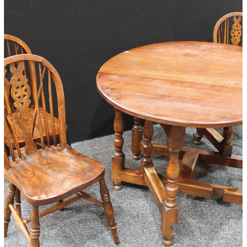 259 - A 17th century style gateleg dining table; a set of four wheel back dining side chairs (5)