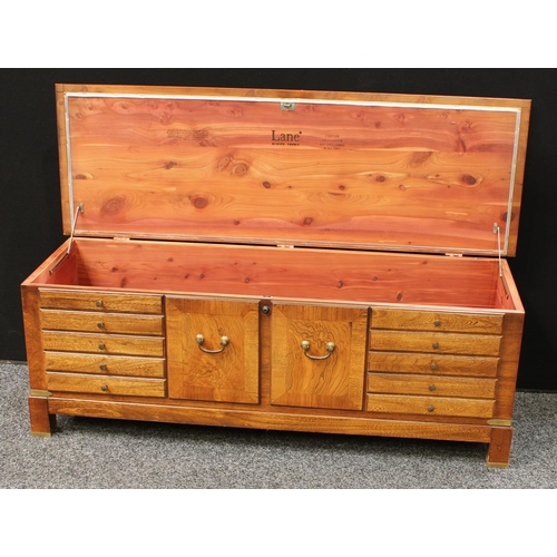 276 - A mid-late 20th century American blanket chest, hinged rectangular top above front blindly applied w... 