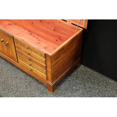 276 - A mid-late 20th century American blanket chest, hinged rectangular top above front blindly applied w... 