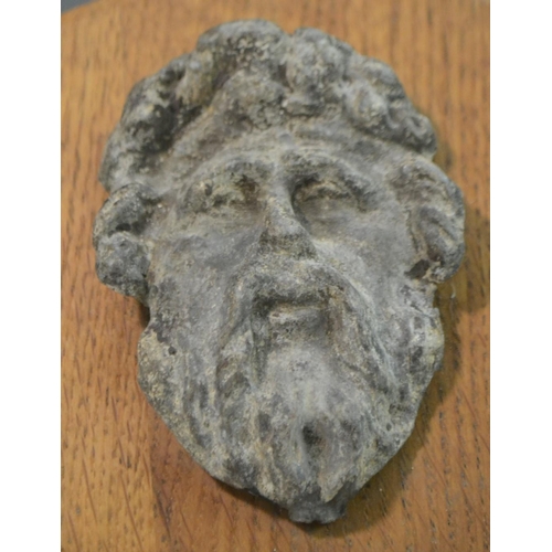 3010 - A 17th/18th century lead boss, cast as a bearded mask, mounted for the connoisseur on an oak shield,... 