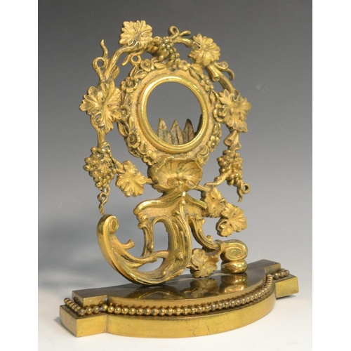 3017 - A 19th century gilt metal pocket watch stand, cast with fruiting vine, flowers, acanthus and a shell... 