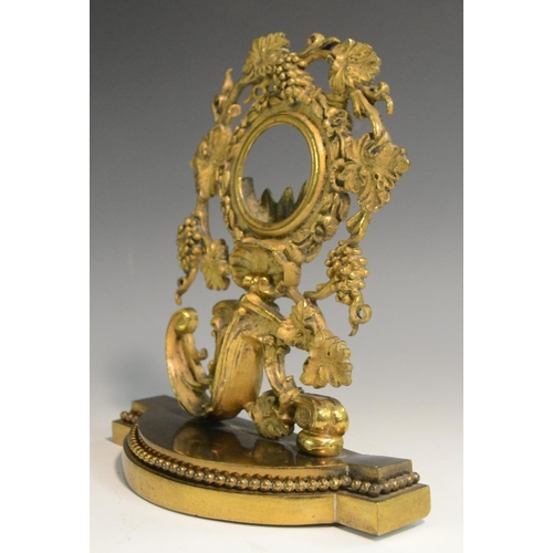 3017 - A 19th century gilt metal pocket watch stand, cast with fruiting vine, flowers, acanthus and a shell... 