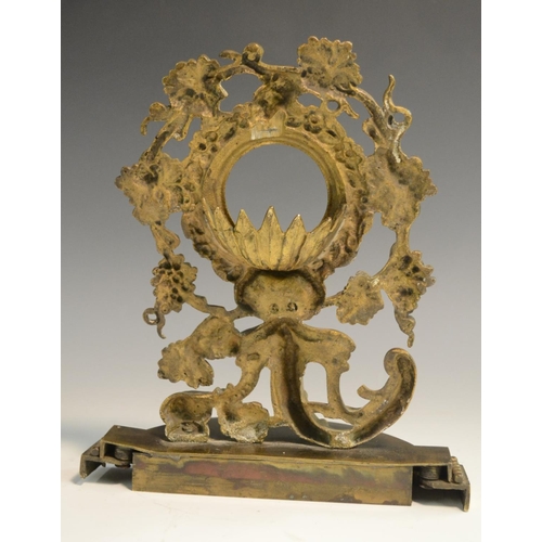 3017 - A 19th century gilt metal pocket watch stand, cast with fruiting vine, flowers, acanthus and a shell... 