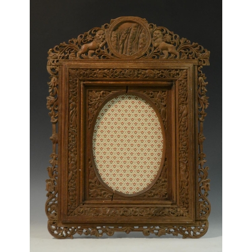 3022 - A 19th century Indian sandalwood shaped rectangular easel photograph or picture frame, pierced and p... 