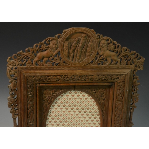 3022 - A 19th century Indian sandalwood shaped rectangular easel photograph or picture frame, pierced and p... 