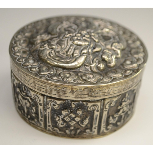 3041 - A 19th century silver coloured metal circular box and cover, possibly Turkish, chased overall with s... 