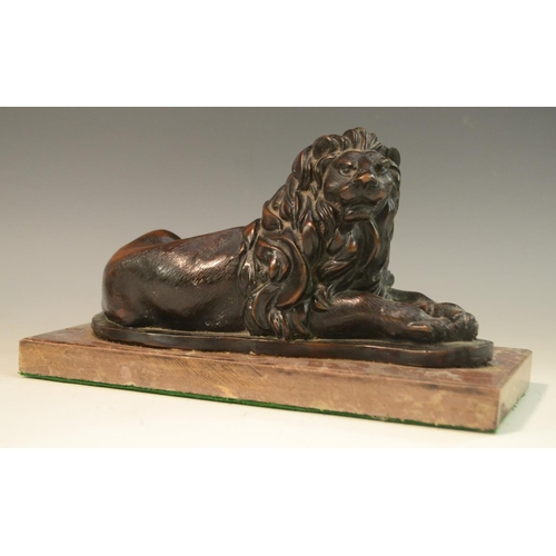 3059 - A bronzed library model, of a recumbent lion, rectangular marble base, 25.5cm wide