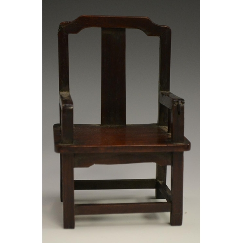 3069 - A Chinese hardwood miniature model, of an armchair, probably from a domestic altar, 14cm high, c. 19... 