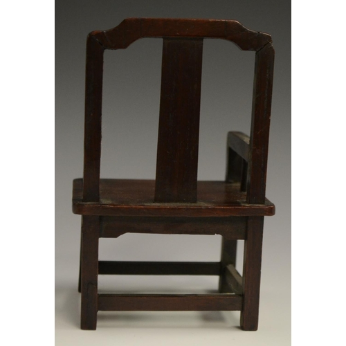 3069 - A Chinese hardwood miniature model, of an armchair, probably from a domestic altar, 14cm high, c. 19... 