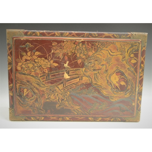 3070 - A Chinese lacquer bowed rectangular work box, hinged cover decorated in raised gilt with a bridge in... 