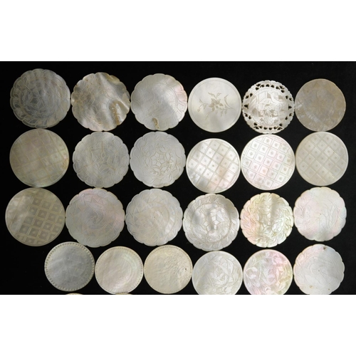 3077 - A collection of Chinese mother-of-pearl circular gaming counters, variously engraved, Canton, 19th c... 