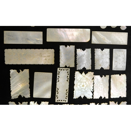 3078 - A collection of Chinese mother-of-pearl gaming counters, various shapes, including fish, engraved, C... 