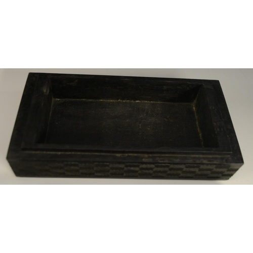 3079 - A Colonial ebony box and cover, carved in relief with stylised birds, palm leaves and geometric moti... 