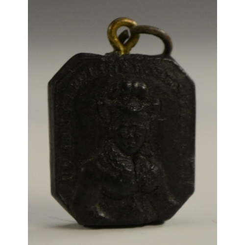 3088 - A George II composition royal commemorative memento mori pendant, the memorial tablet pressed with a... 