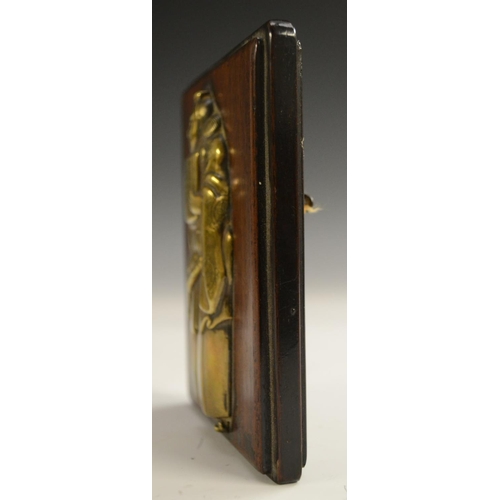 3101 - A Japanese bronze-mounted hardwood plaque, the front inset with a figural relief of an official, the... 