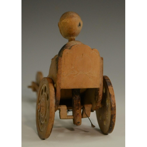 3104 - A Japanese Kobe automaton toy, as a comical figure in a carriage, the wheels animating his limbs, 20... 