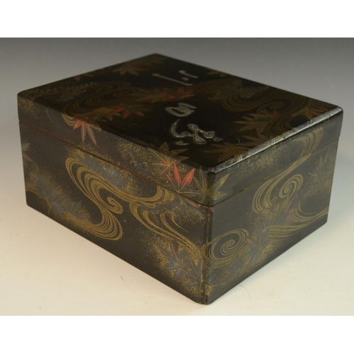 3105 - A Japanese silver mounted lacquer box and cover, decorated in red and gilt with swirls and autumnal ... 