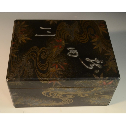 3105 - A Japanese silver mounted lacquer box and cover, decorated in red and gilt with swirls and autumnal ... 