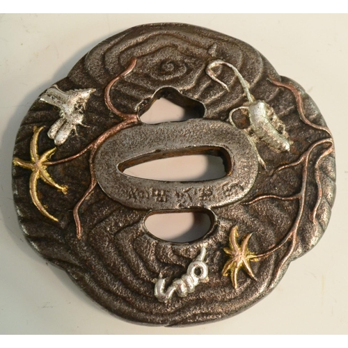 3107 - A Japanese tsuba, cast and applied with silvered and gilt insects, 8cm wide, signed, Meiji period