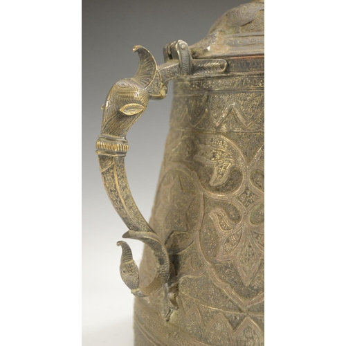 3108 - A Kashmiri copper flagon, profusely chased in the Persian taste with stylised lotus, flowering meand... 