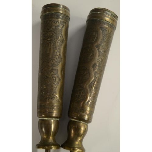 3126 - A pair of 19th century Chinese brass scroll or banner holders, chased with characters and ferocious ... 