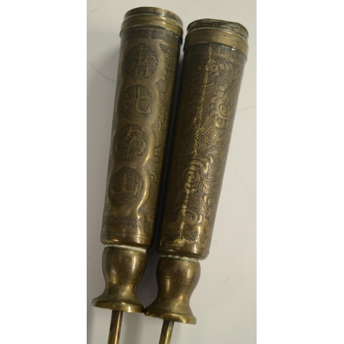 3126 - A pair of 19th century Chinese brass scroll or banner holders, chased with characters and ferocious ... 