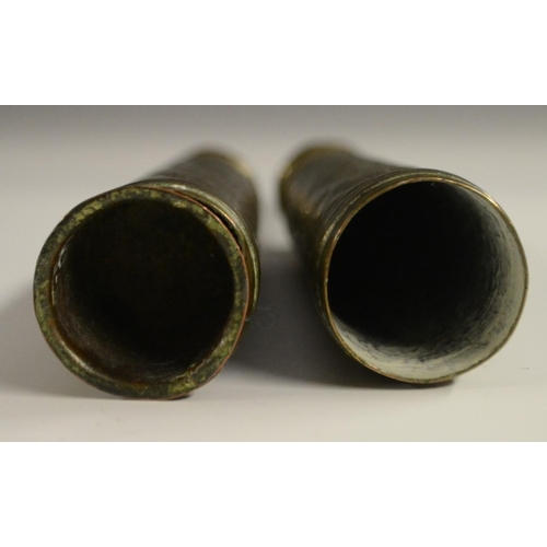 3126 - A pair of 19th century Chinese brass scroll or banner holders, chased with characters and ferocious ... 