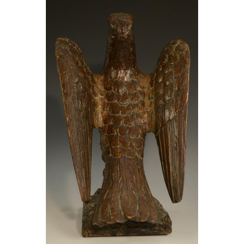 3127 - A pair of 19th century oak country house newel post crestings, each well carved as a falcon, the bea... 