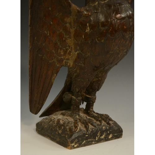 3127 - A pair of 19th century oak country house newel post crestings, each well carved as a falcon, the bea... 