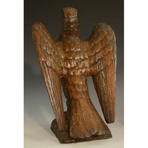 3127 - A pair of 19th century oak country house newel post crestings, each well carved as a falcon, the bea... 