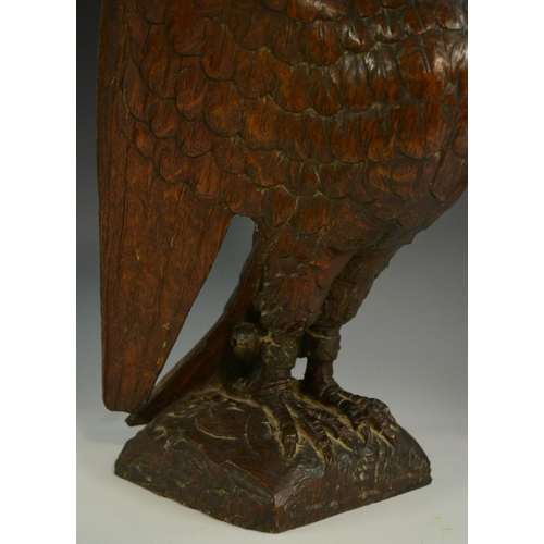 3127 - A pair of 19th century oak country house newel post crestings, each well carved as a falcon, the bea... 