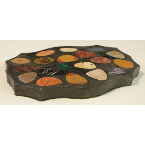 3137 - A pietra dura shaped oval desk weight, inlaid with pebble shaped reserves of malachite, amethyst qua... 