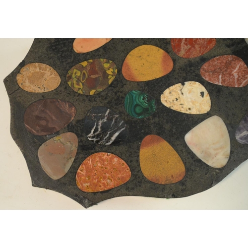 3137 - A pietra dura shaped oval desk weight, inlaid with pebble shaped reserves of malachite, amethyst qua... 