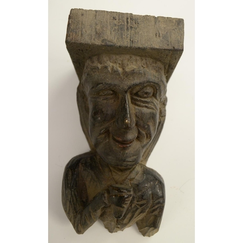 3138 - A post-Medieval oak corbel grotesque, carved as a bearded man, his tongue protruding, 14cm long; ano... 