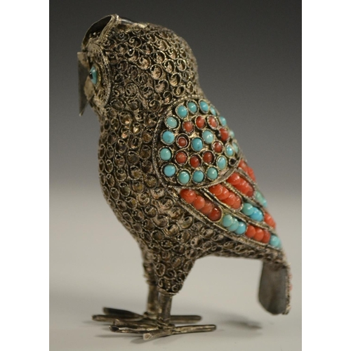 3150 - A Tibetan silver model of an owl, applied with turquoise and coral cabochons, 6.5cm high