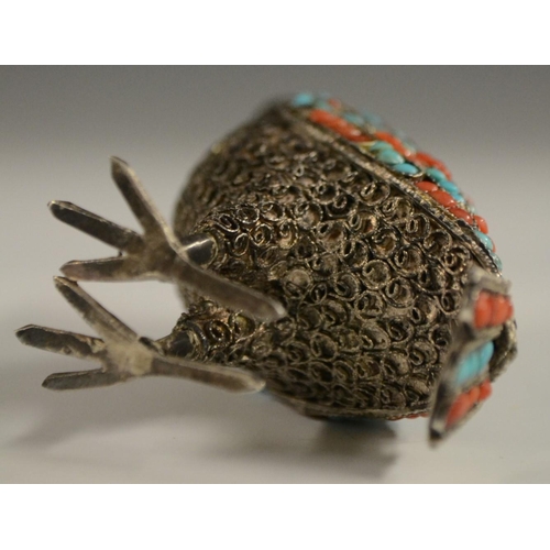 3150 - A Tibetan silver model of an owl, applied with turquoise and coral cabochons, 6.5cm high