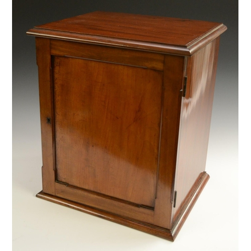 3155 - A Victorian mahogany collector's table cabinet, rectangular moulded top above a panelled door enclos... 