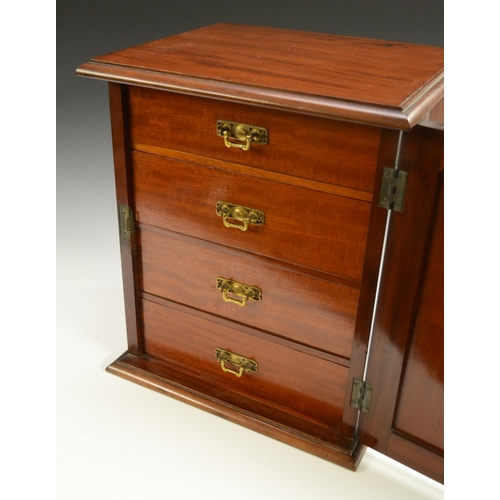 3155 - A Victorian mahogany collector's table cabinet, rectangular moulded top above a panelled door enclos... 