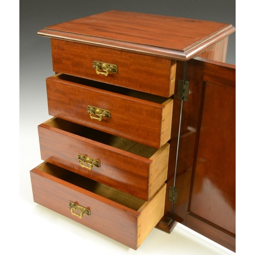 3155 - A Victorian mahogany collector's table cabinet, rectangular moulded top above a panelled door enclos... 